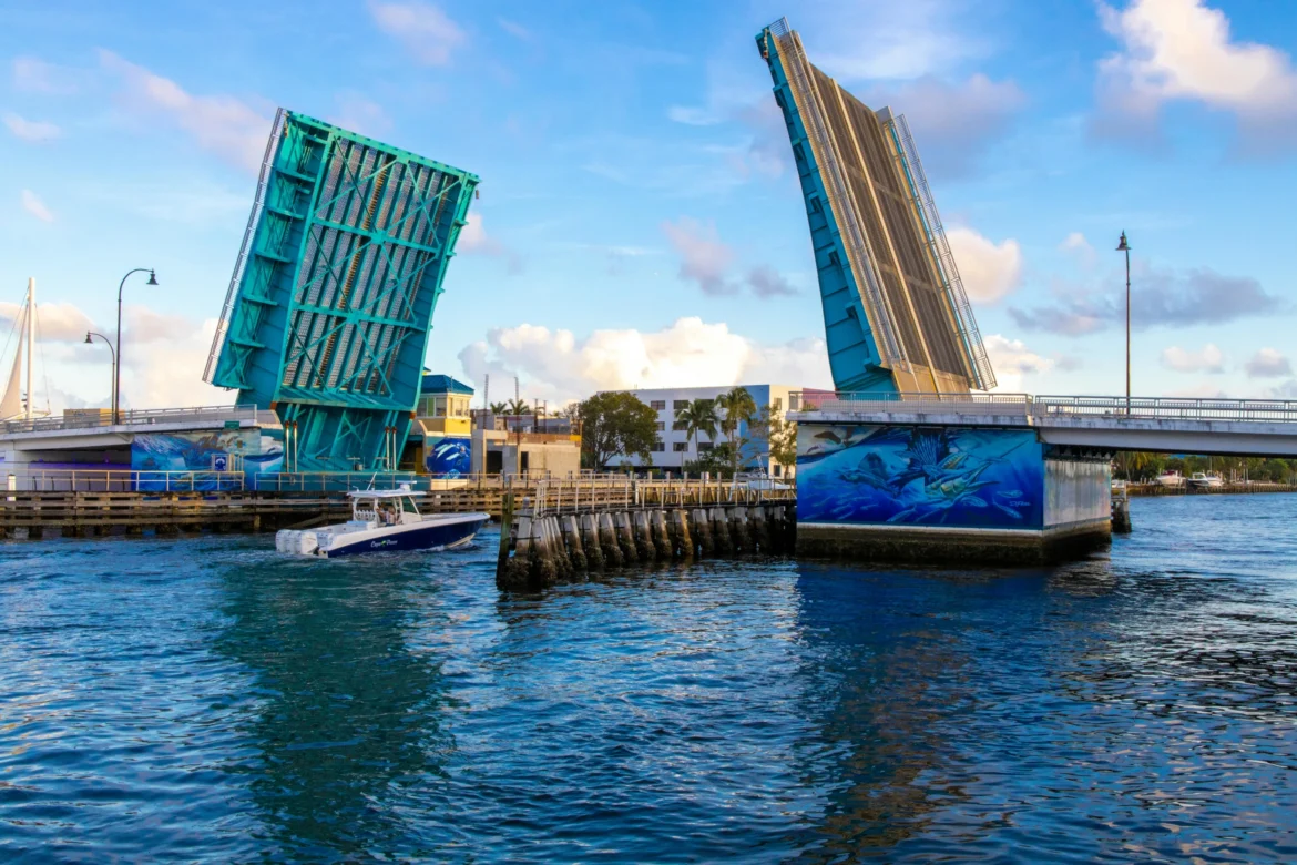 boat under bridge in fort lauderdale heading to marina