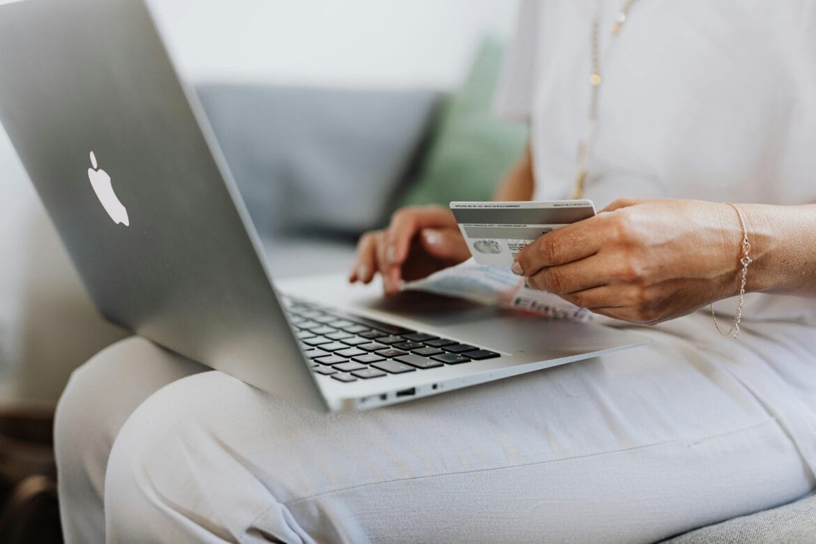 woman using macbook browsing an ecommerce website made with woocommerce