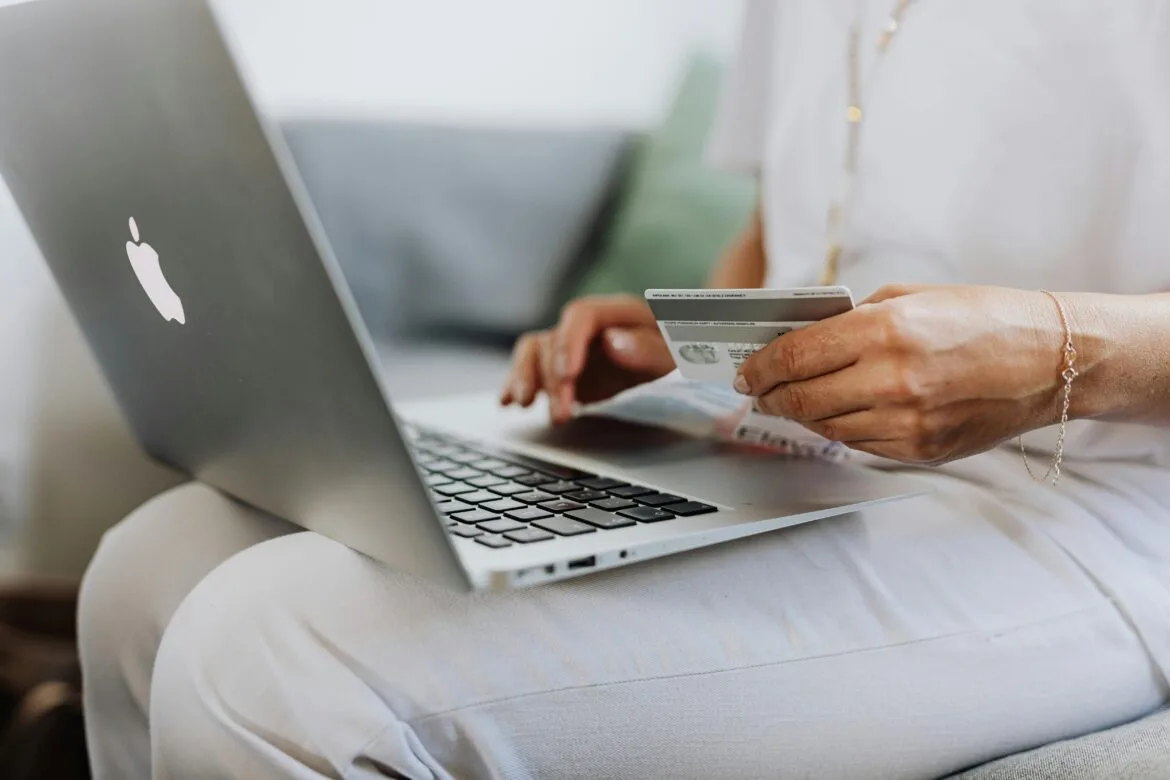 woman using macbook browsing an ecommerce website made with woocommerce