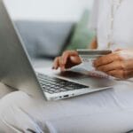 WooCommerce Web Designer in South Florida 2 woman using macbook browsing an ecommerce website made with woocommerce