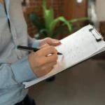 Man writing checklist before starting woocommerce website design and development in Fort Lauderdale